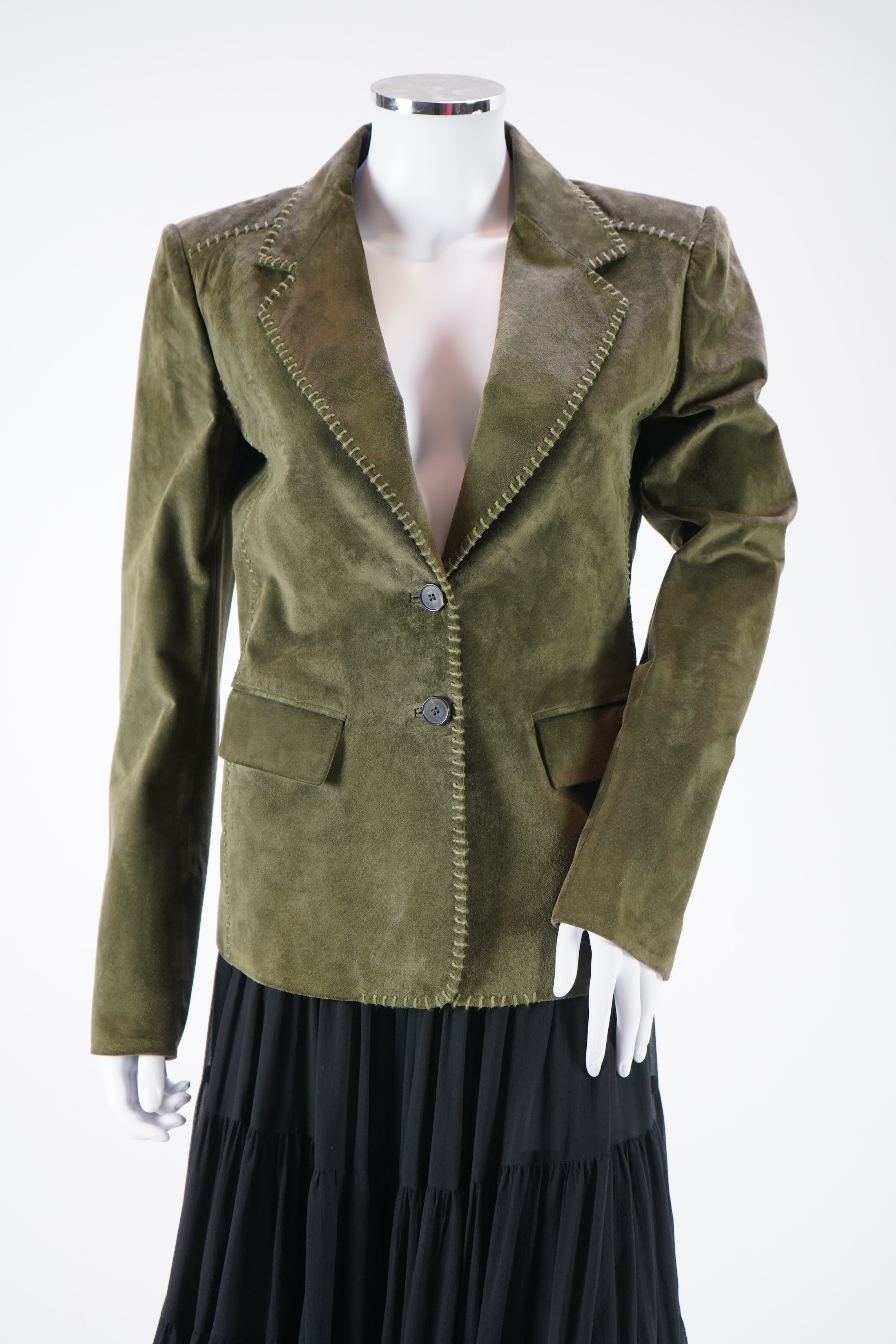 A lady's Yves Saint Laurent olive green suede jacket with stitching details and a black YSL (label missing) gypsy skirt with underskirt. IT 38 (UK size 10)